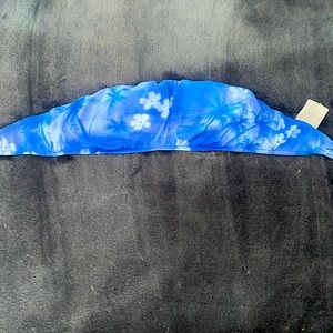 Strapless swim suit top blue with flowers and palm trees.